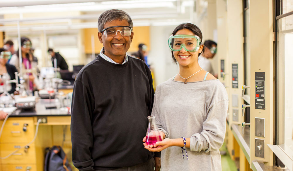 Miramar professor and student with beaker