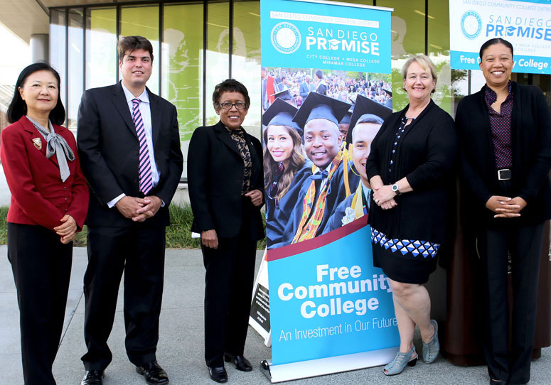 Chancellor and presidents next to a San Diego Promise sign