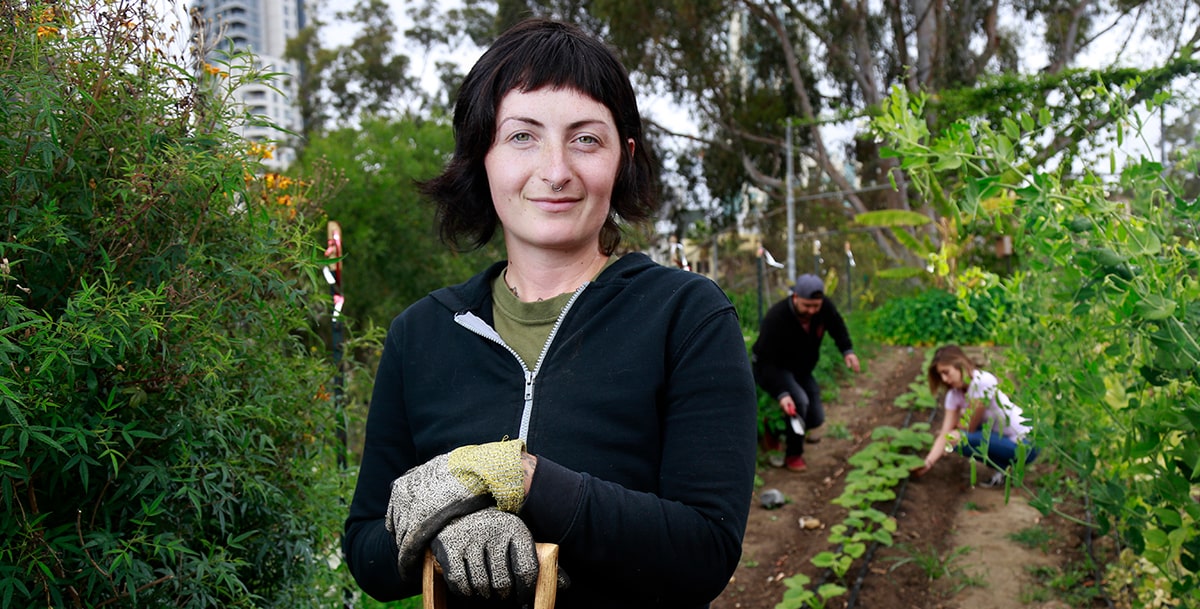 City College Student in the SEEDS garden