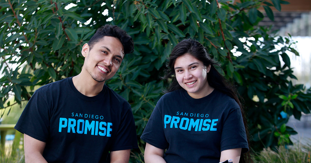 Two students wearing promise t-shirts