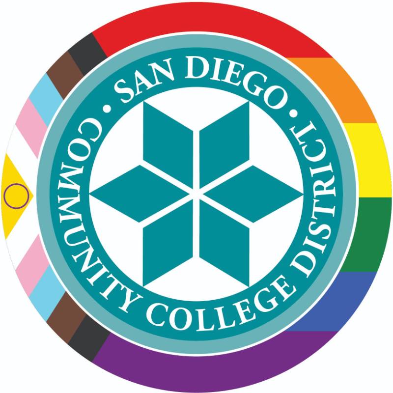 District seal is surrounded by colors of the pride flag
