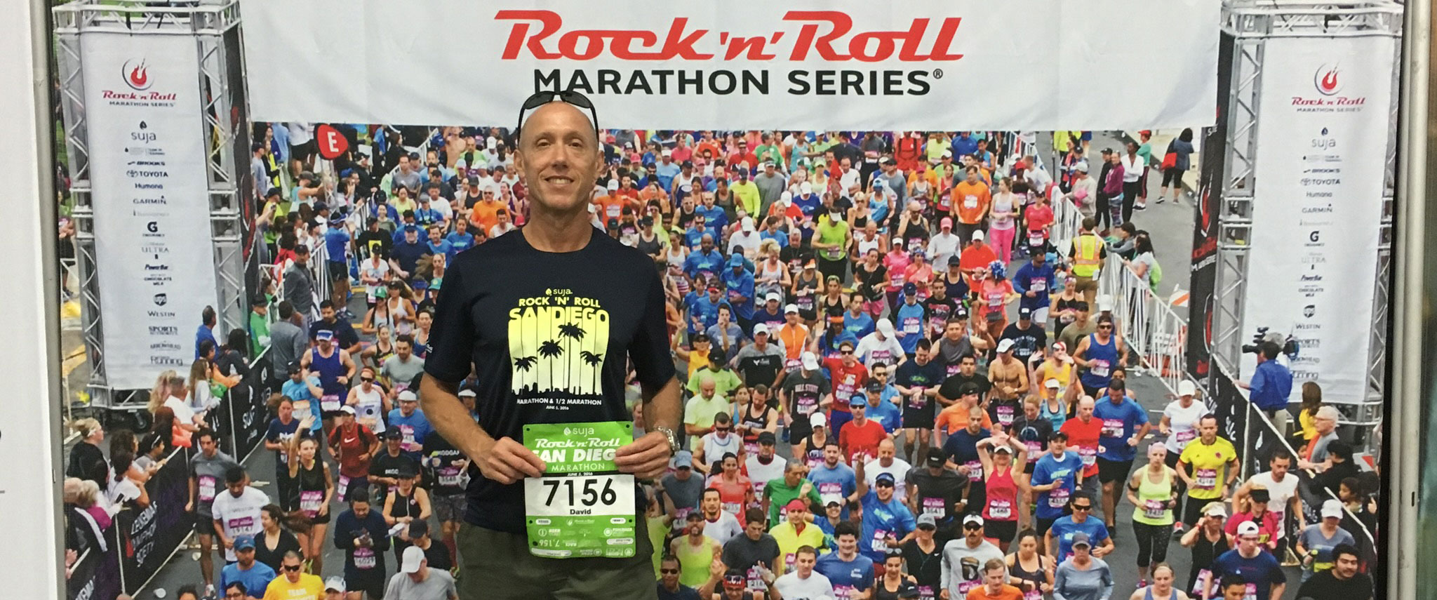 David Weiss holding up a number for a marathon