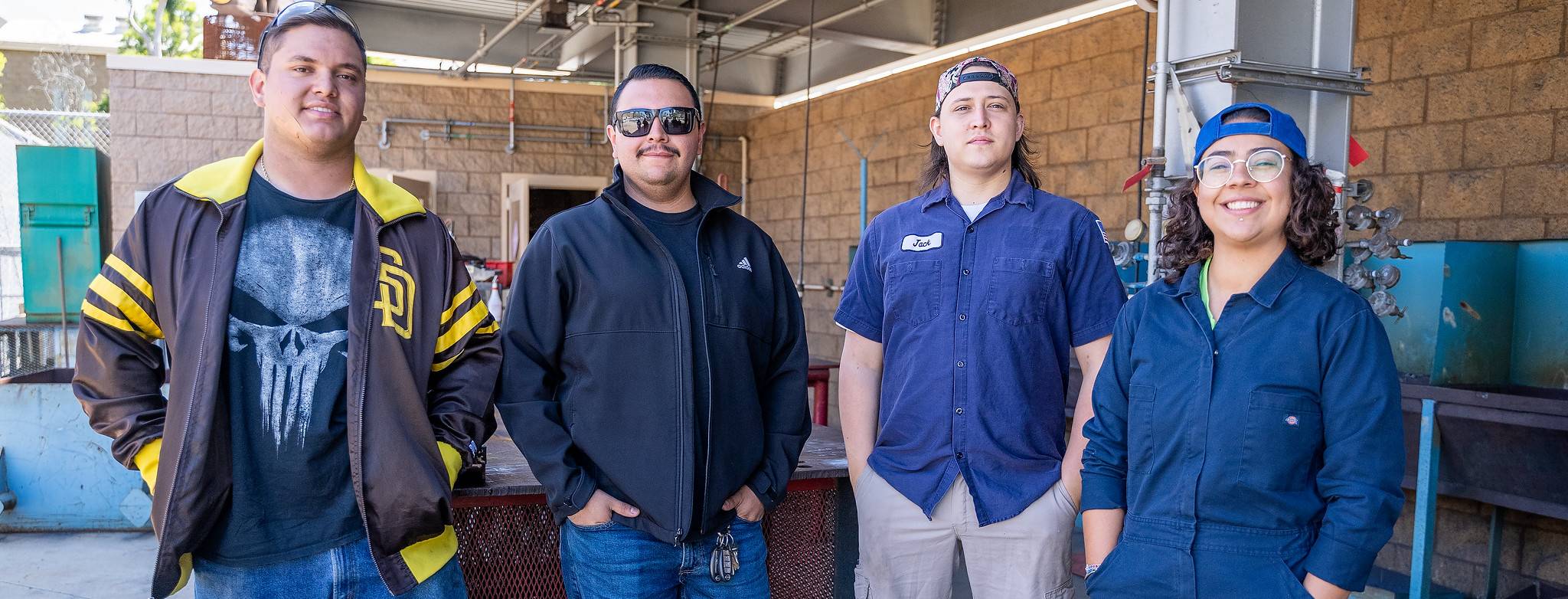 Four student welders outside the welding department