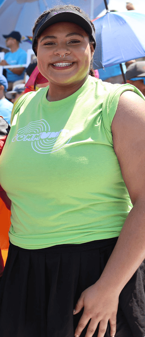Zora Williams in a green t shirt at the pride parade