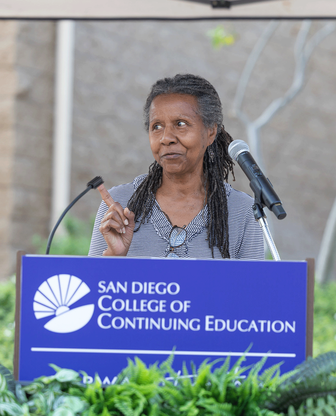 A speaker at a podium at the groundbreaking event.