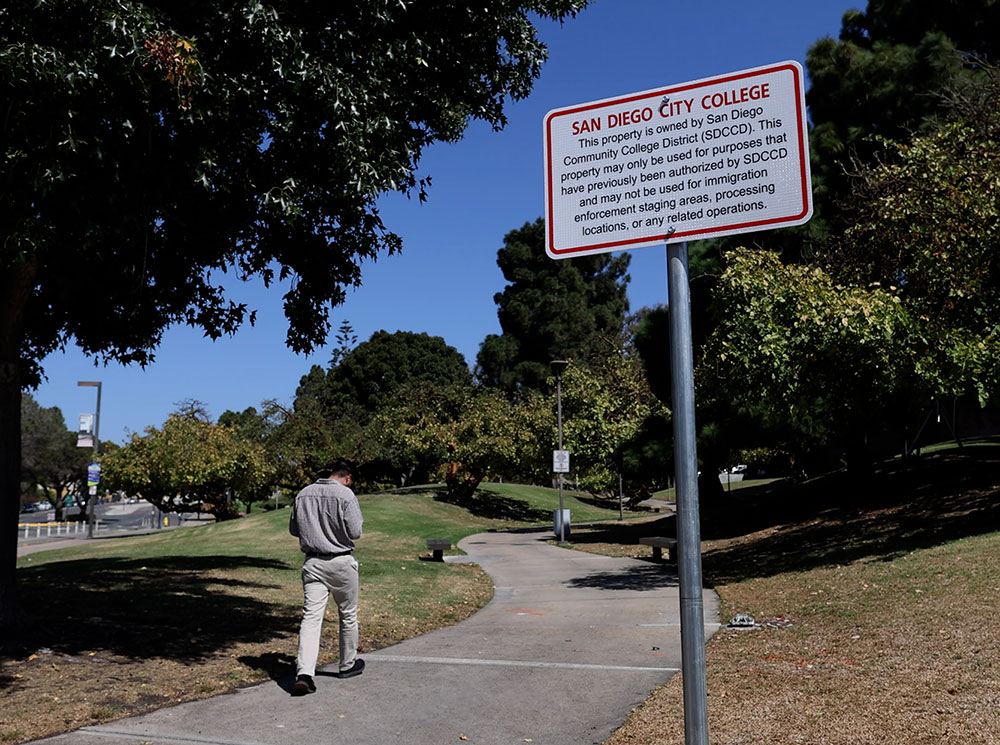One of the new signs along a walkway on City College campus
