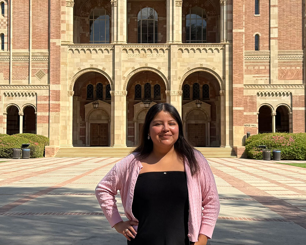 Jeruselen Davila at in front of a building at  UCLA