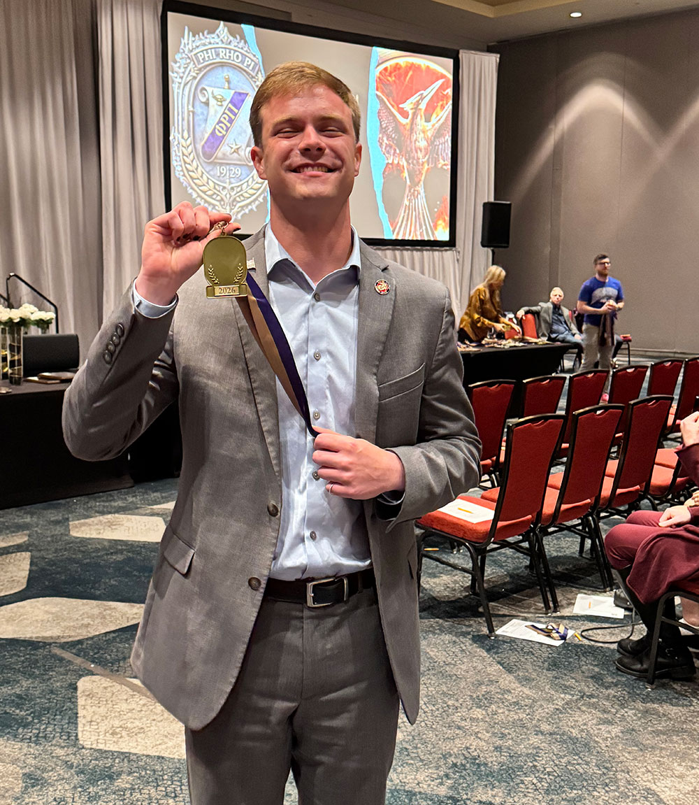 Josh Lewis shows off his gold medal