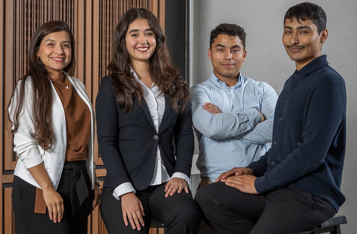 Four student trustees in the lobby of the district office