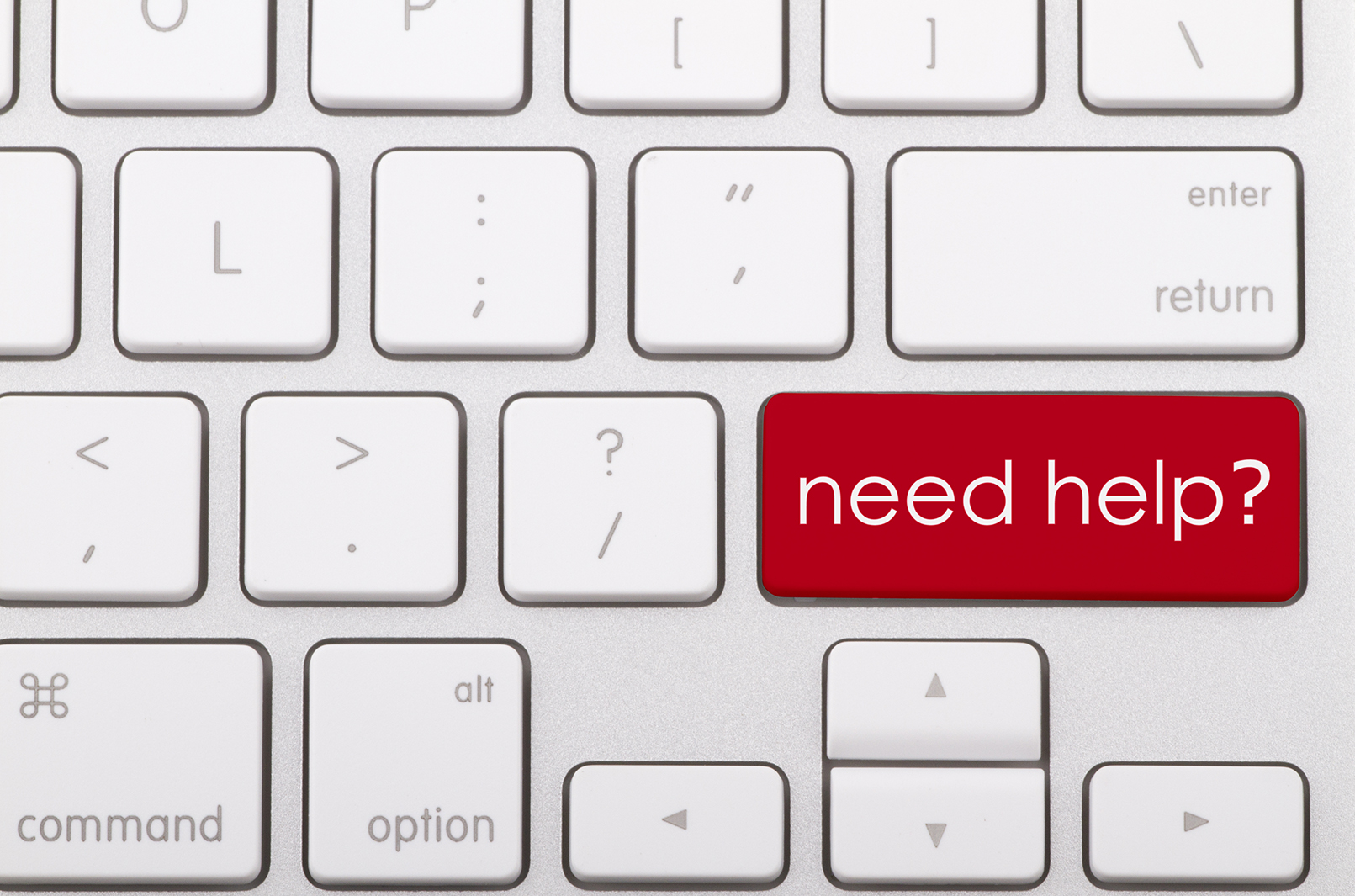 A white keyboard with one red button that says need help