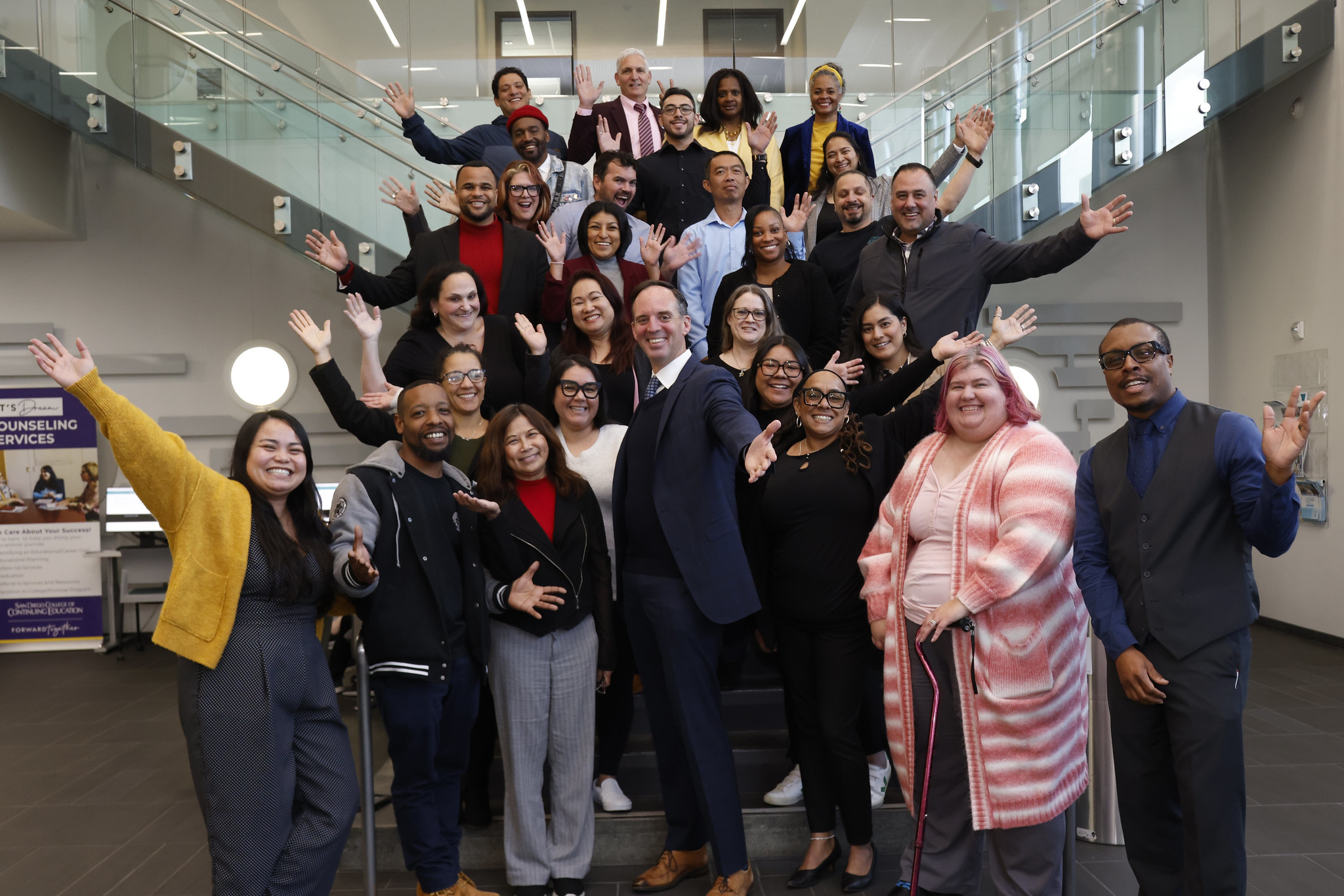
The Management Leadership Development Academy on a set of stairs for a group photo.
