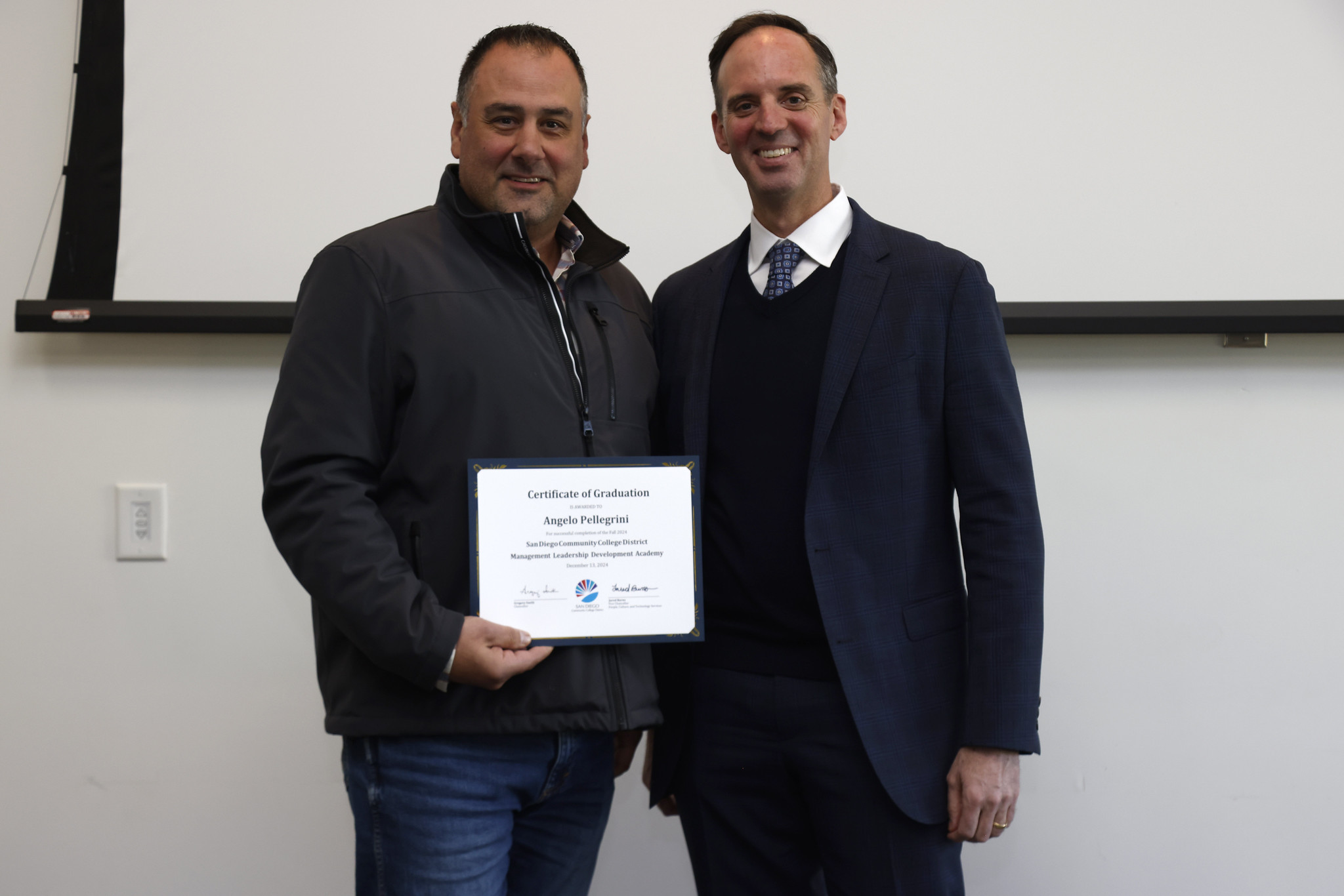 
Angelo Pelligrini receives his certificate.
