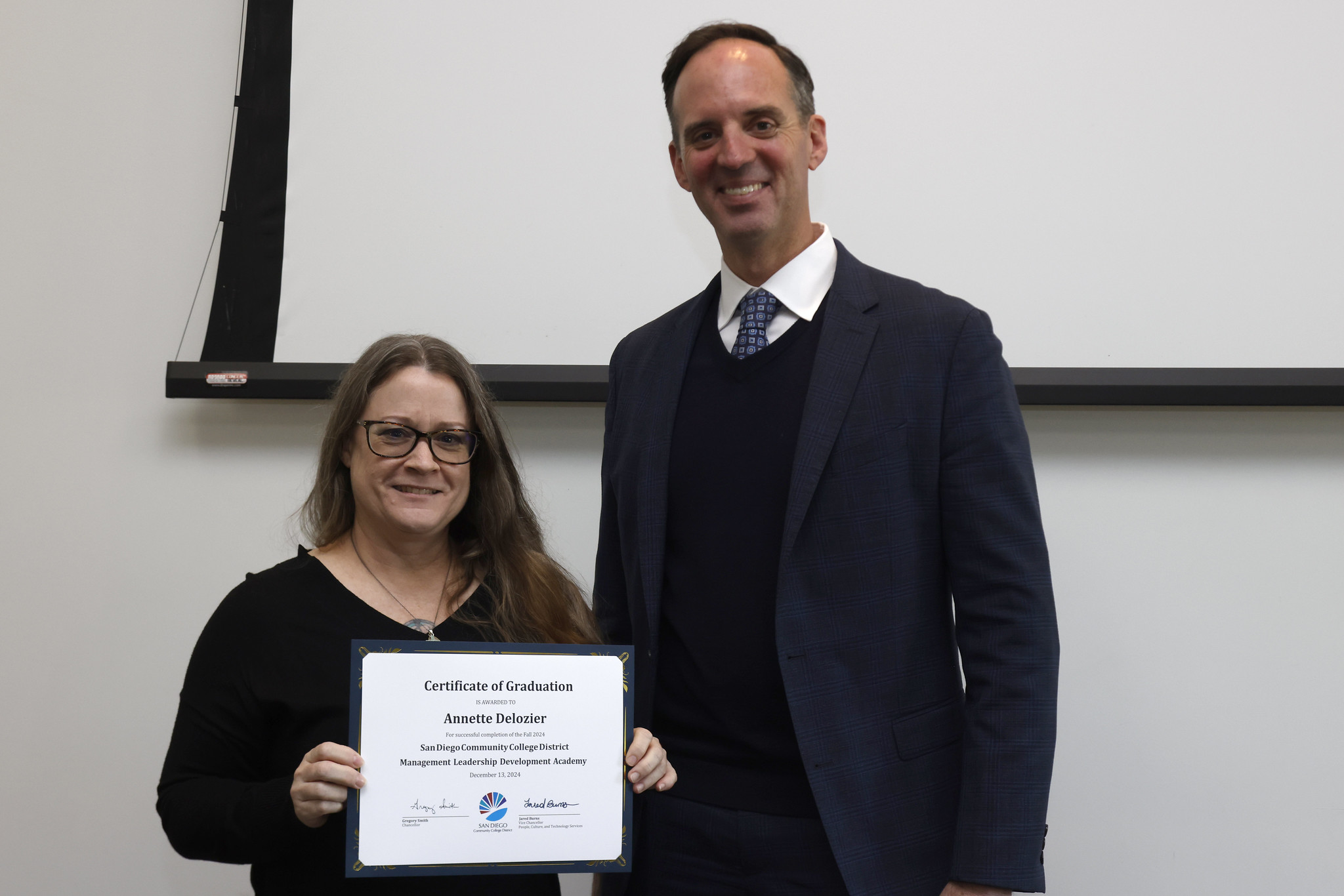 
Annette Delozier receives her certificate for completing the academy.
