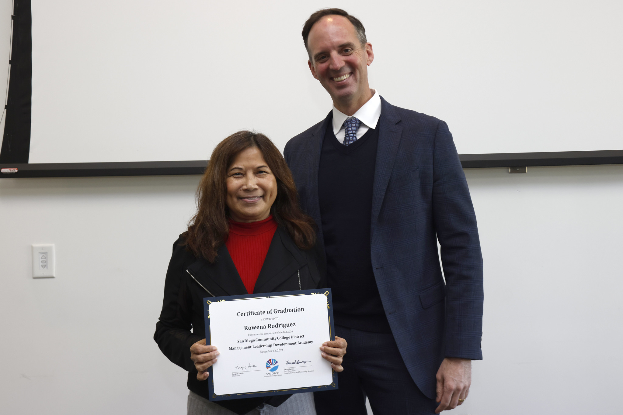 
Rowena Rodriguez receives her certificate.
