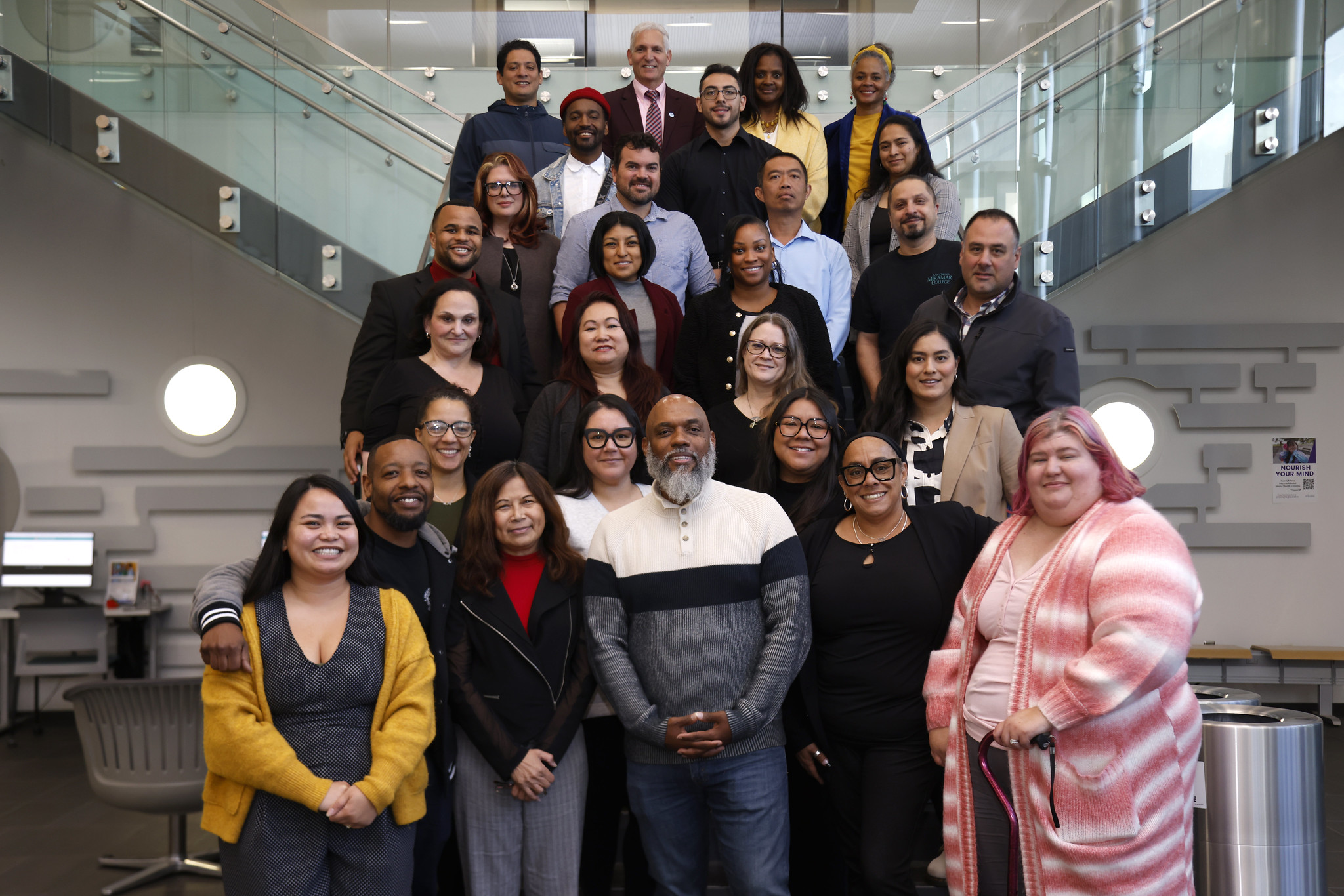 
The Management Leadership Development Academy takes a group photo on a staircase.
