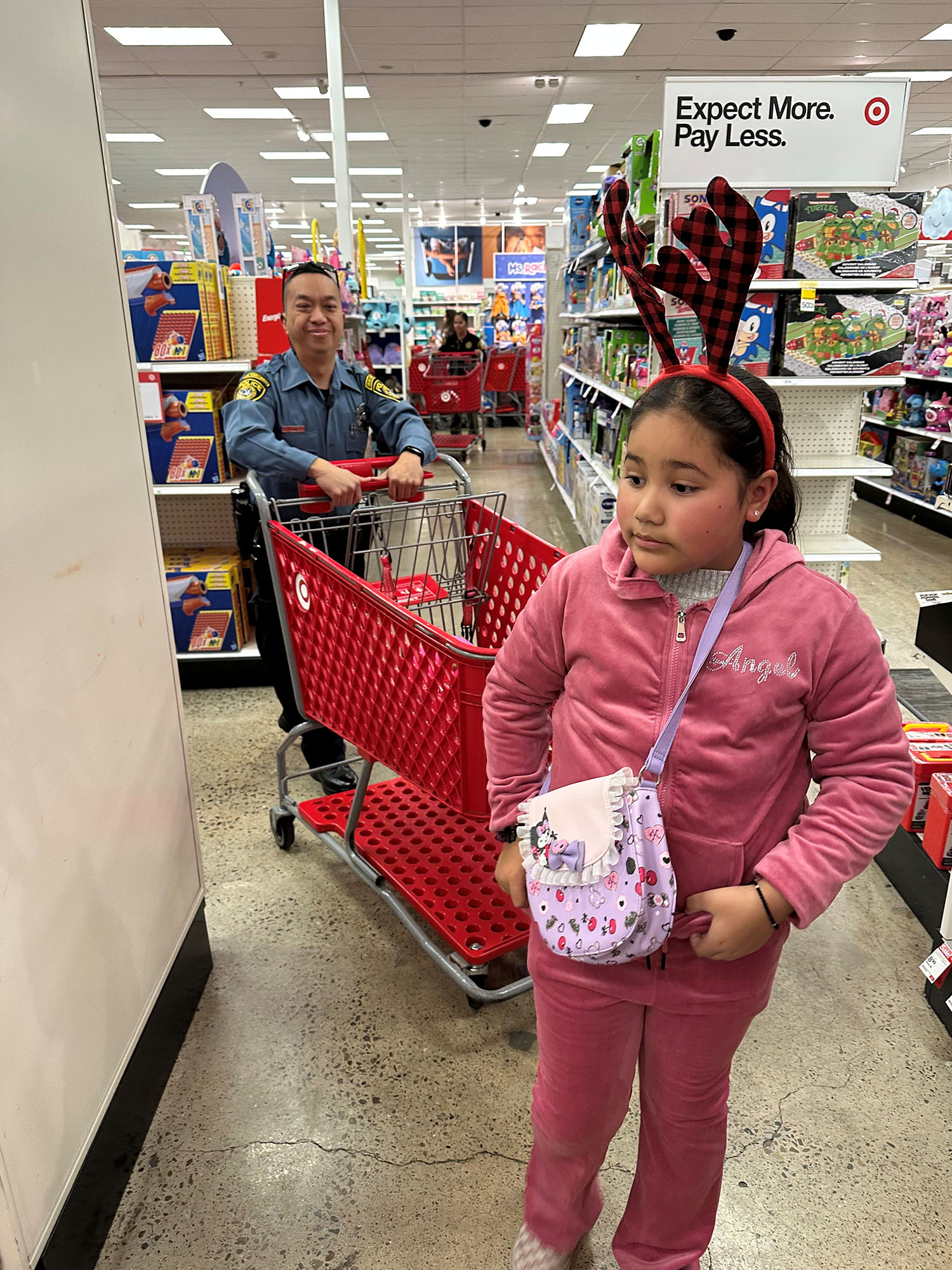 An officer and a child at Target for Shop with a Cop.