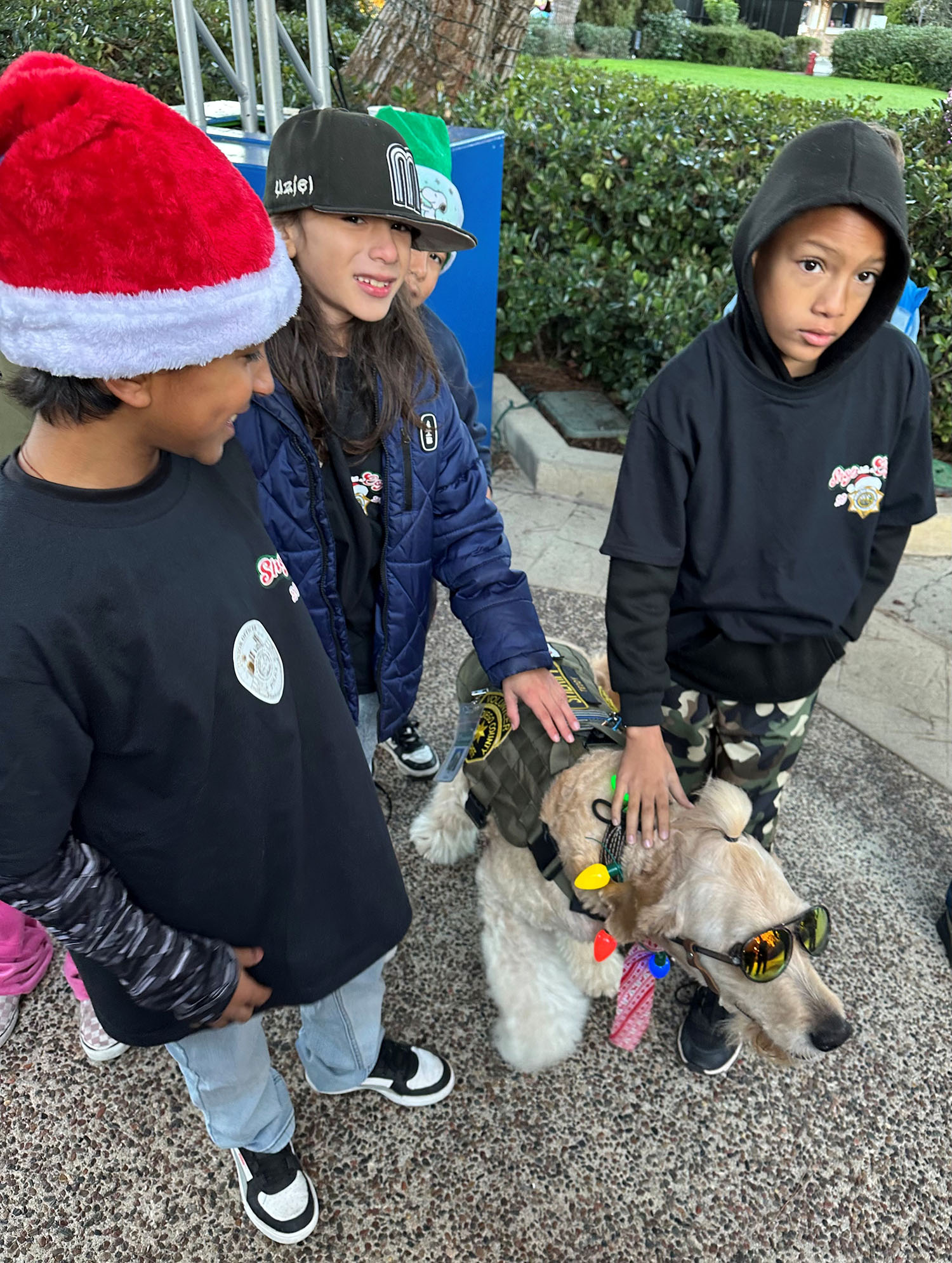 Three children with a police dog