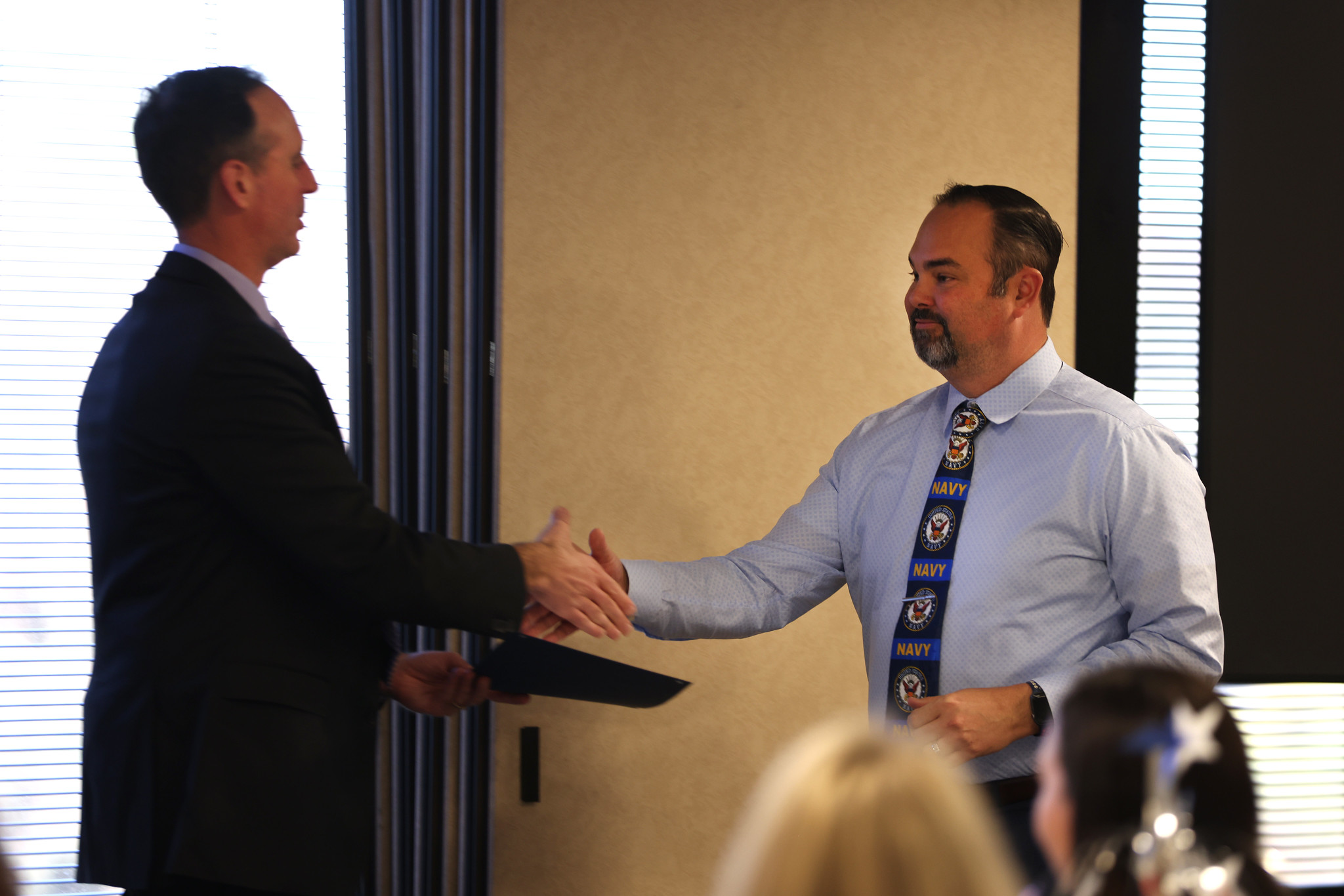 Veteran Jamey Murphy shakes the chancellor's hand