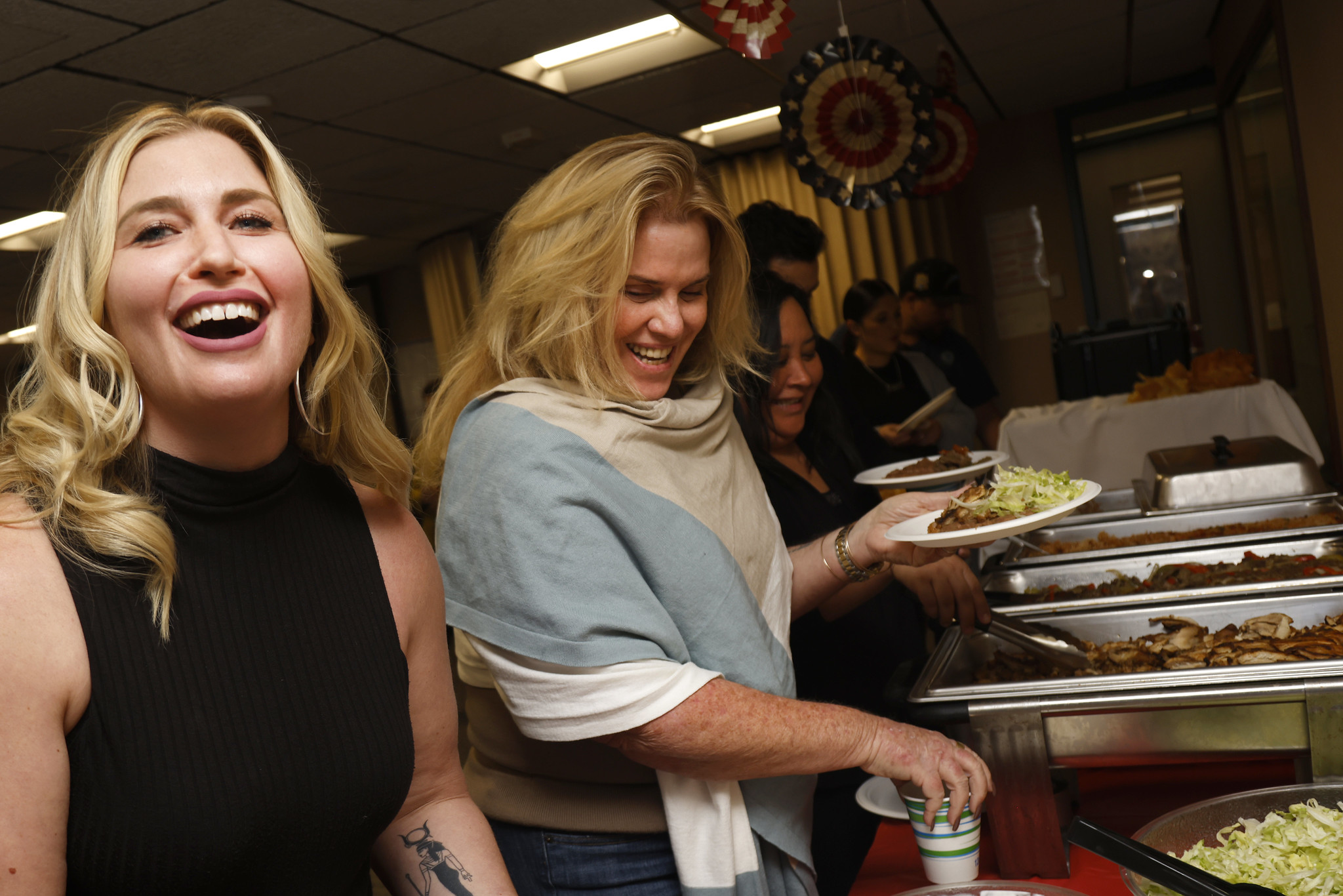 Two women at the buffet.