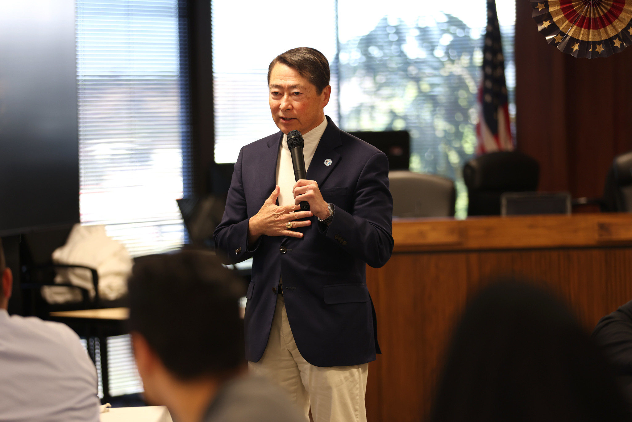 Veteran Joel Peterson speaks to the crowd.