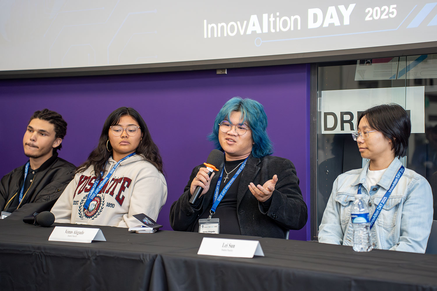 
Four students on a panel.
