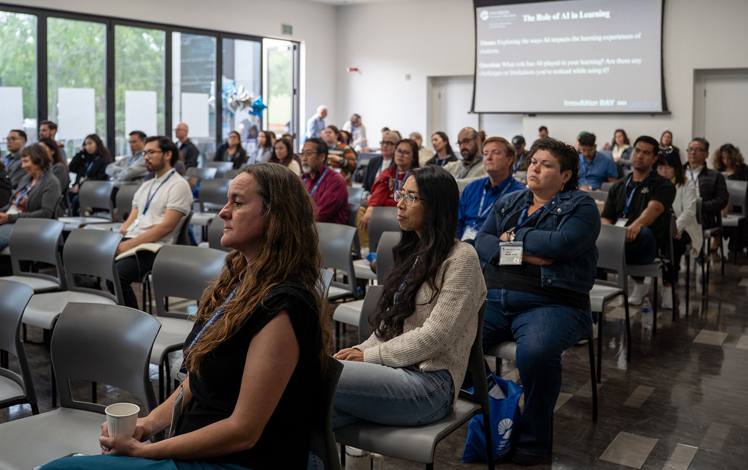 
The audience listens to the panel.
