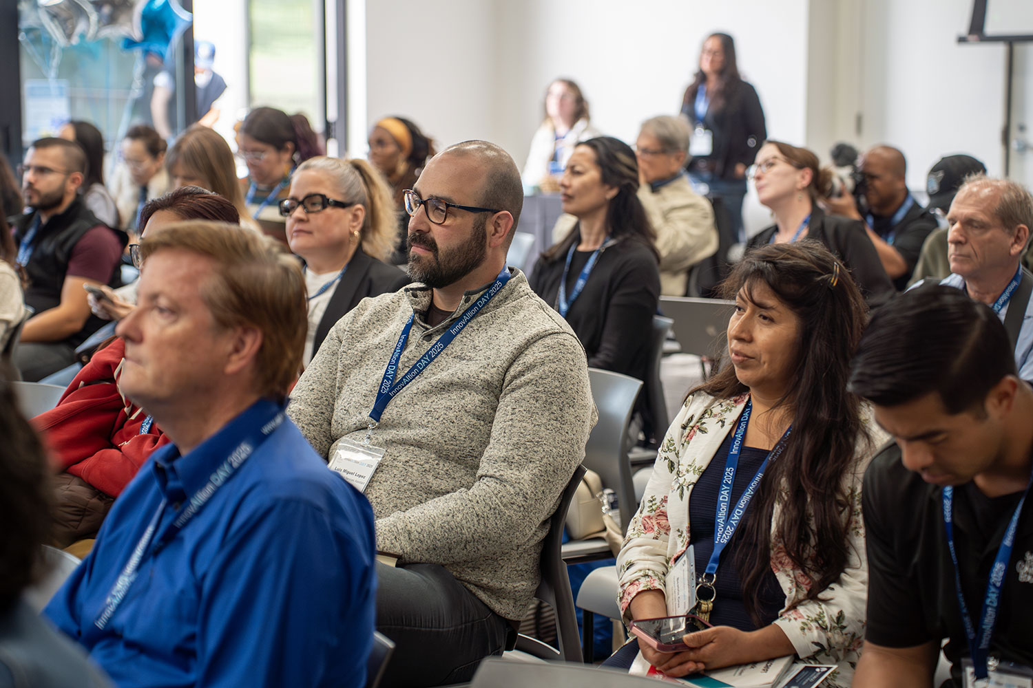 
The audience listens to the panel.
