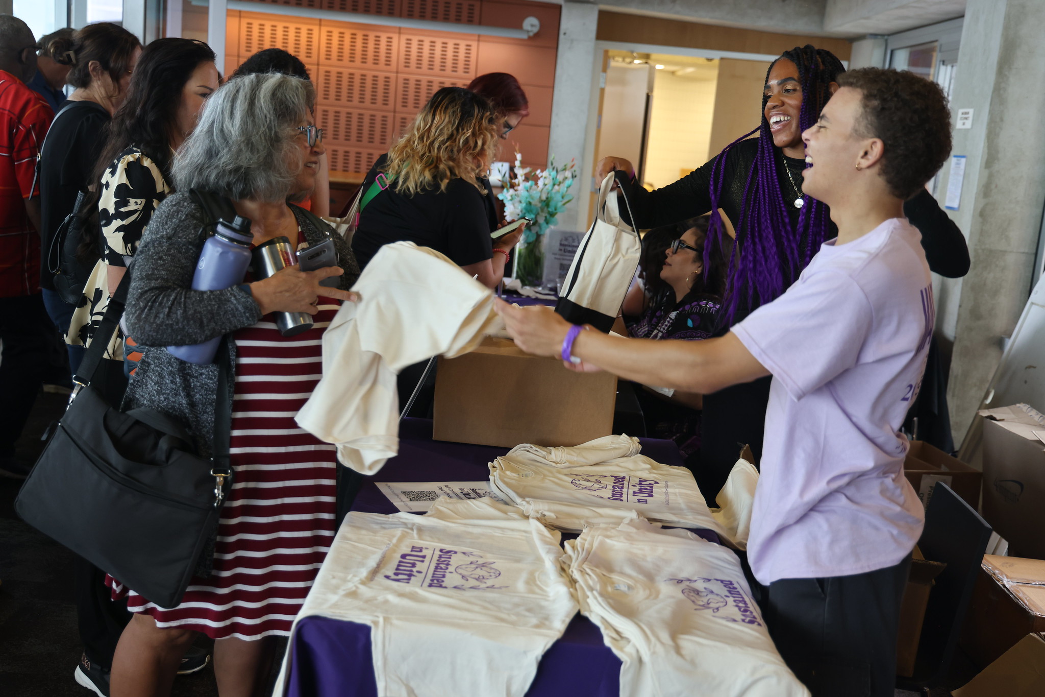 
People entering convocation received t-shirts and a canvas bag.
