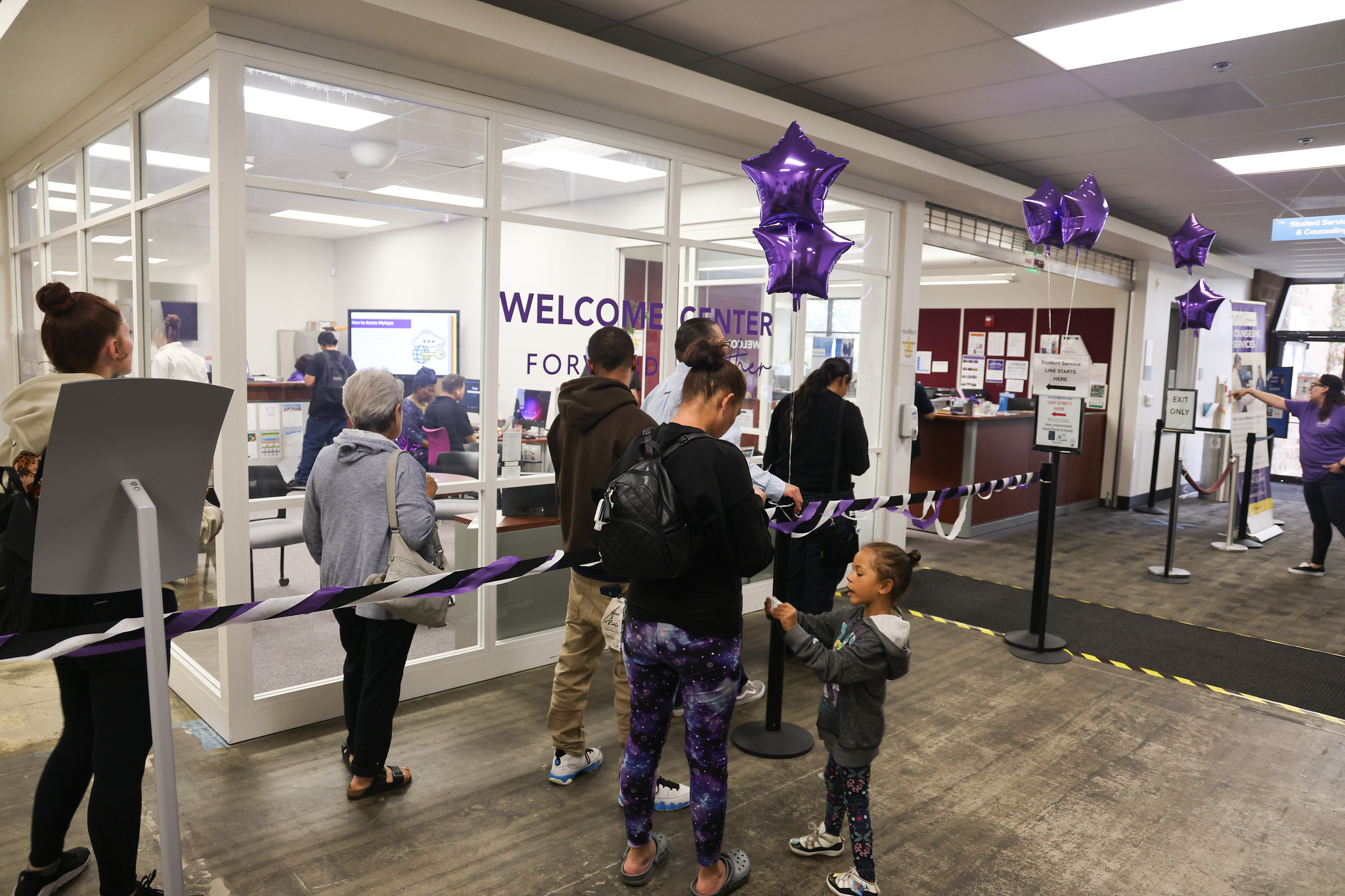 
Students stand in line outside the Welcome Center.
