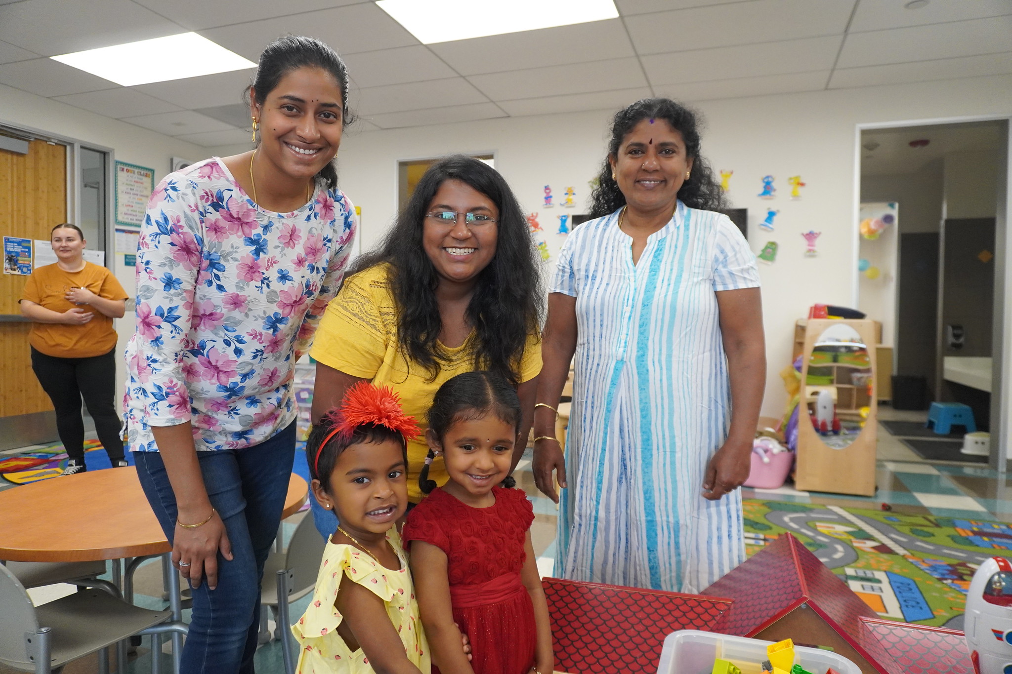 
Three ladies and two children at the child development area.
