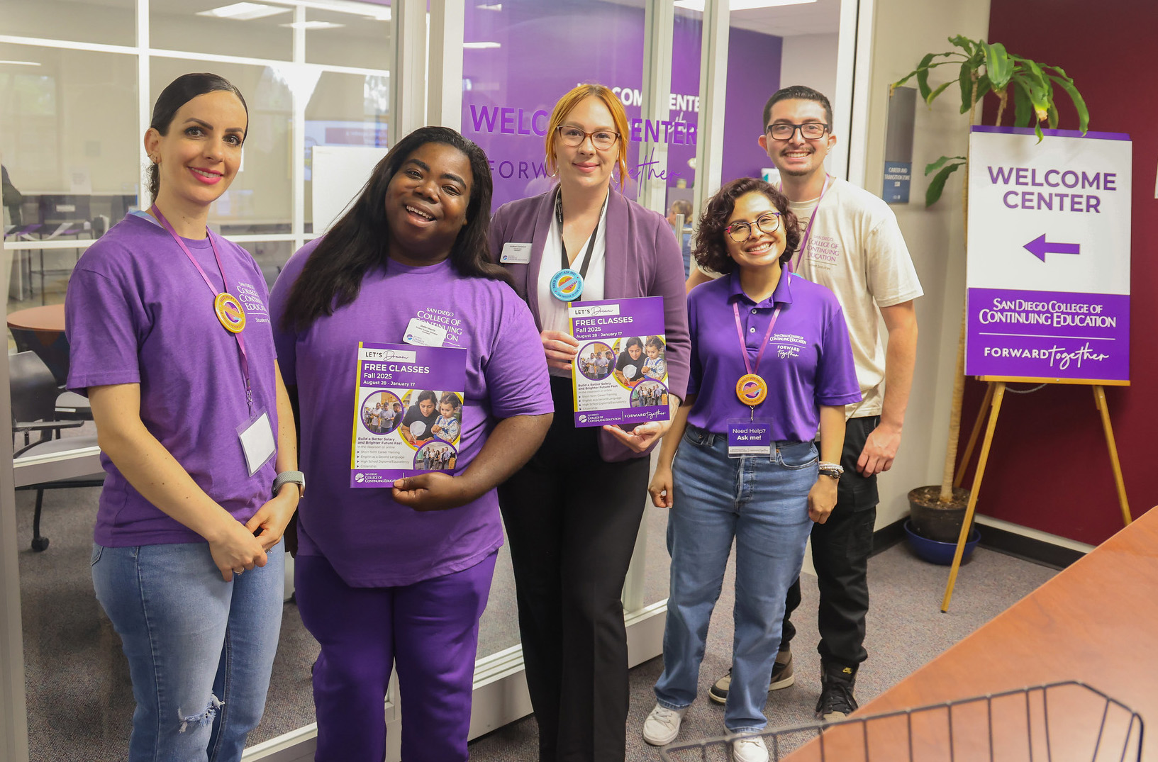 
Five employees standing outside of the Welcome Center.
