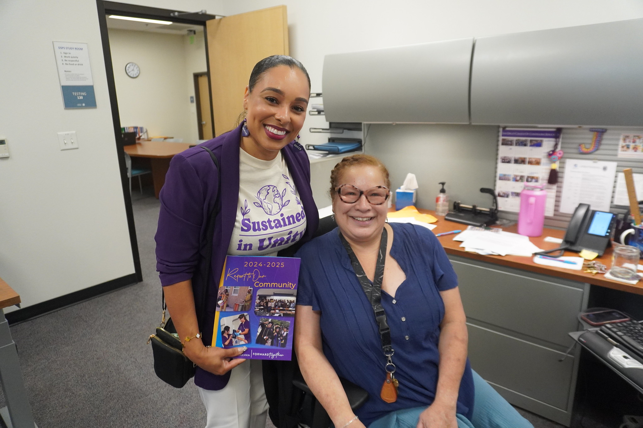 
President Tina King visits with an employee in their office.
