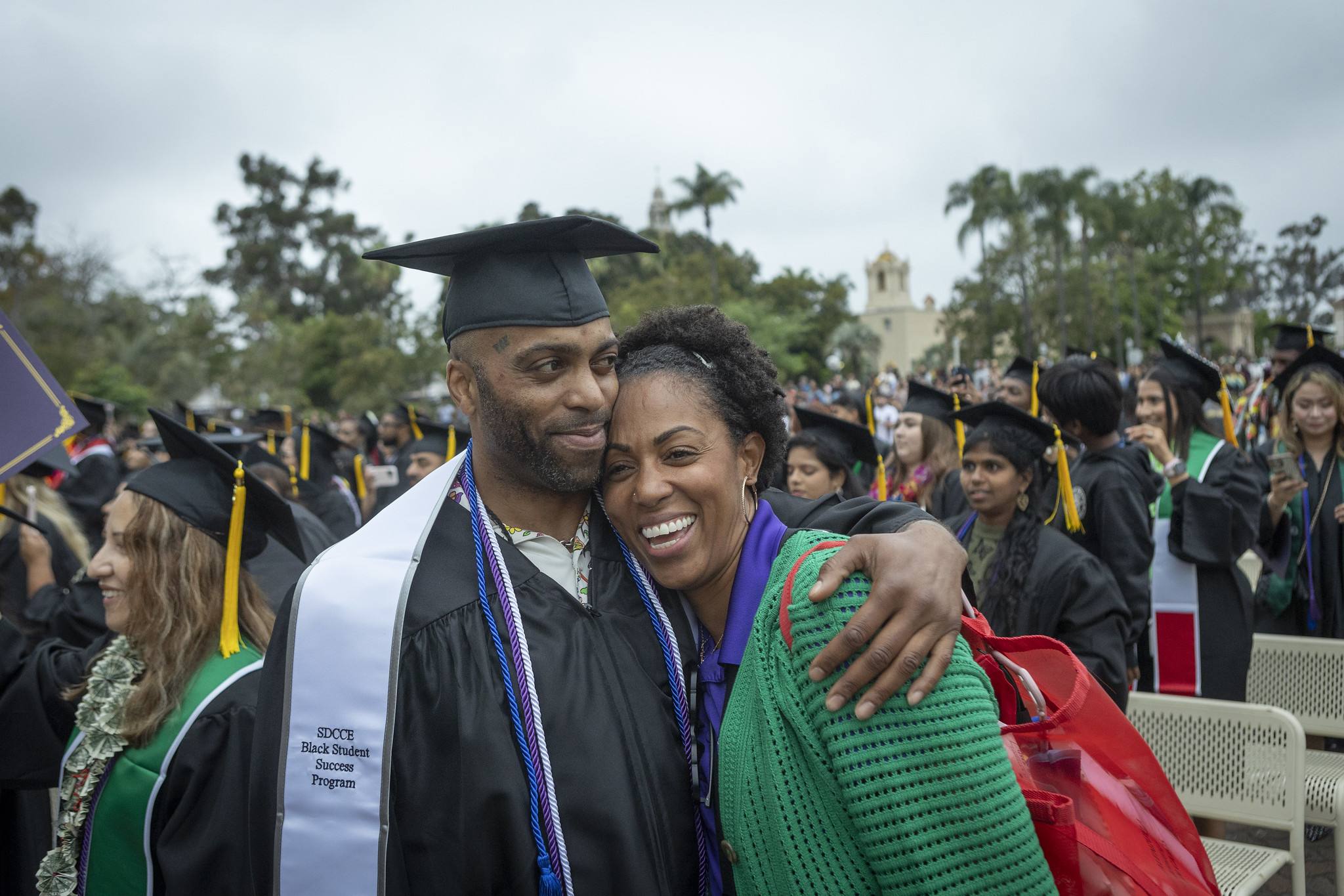 
A graduate hugs a loved one.

