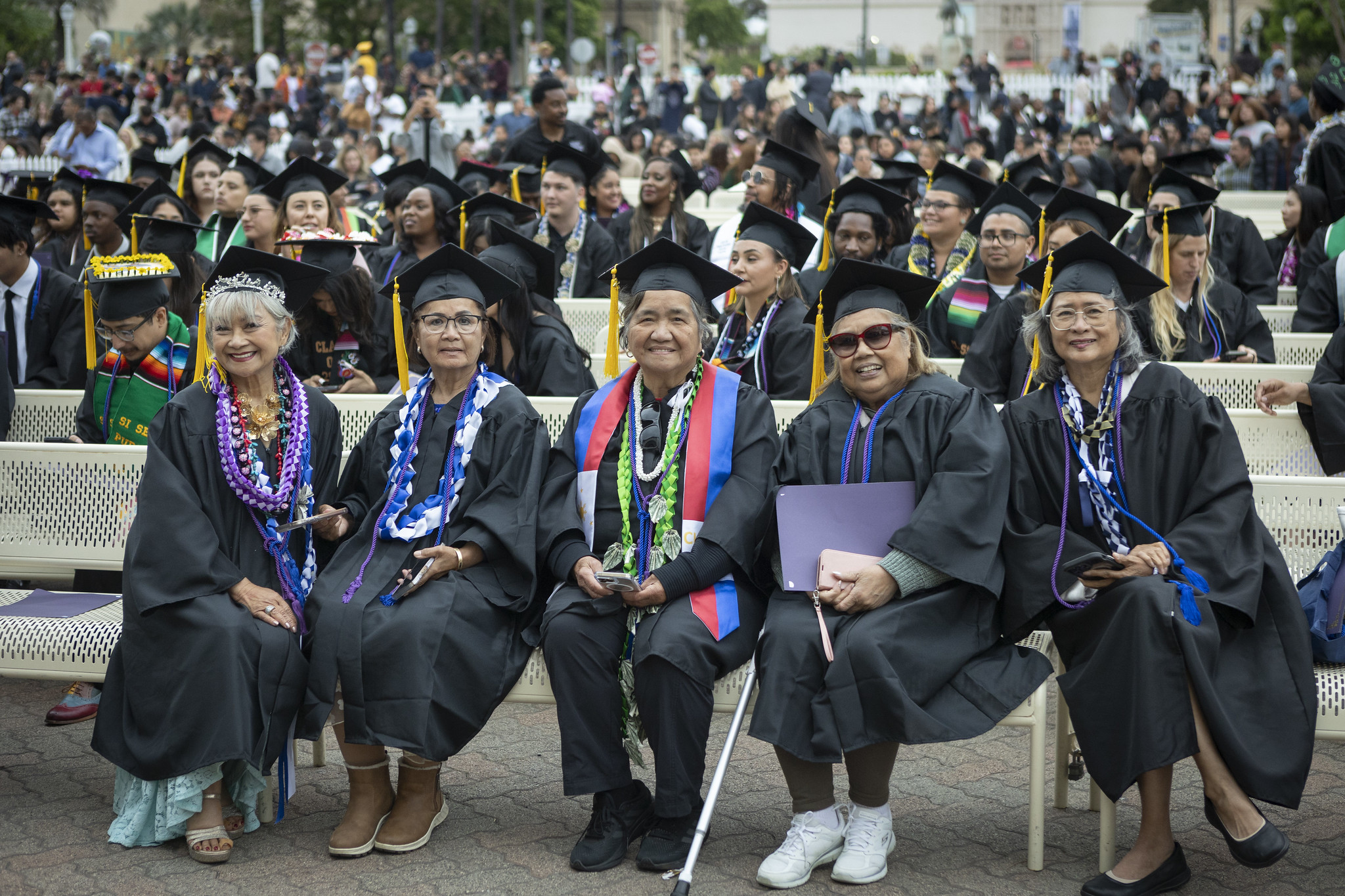 
Five graduates seated during. commencement.
