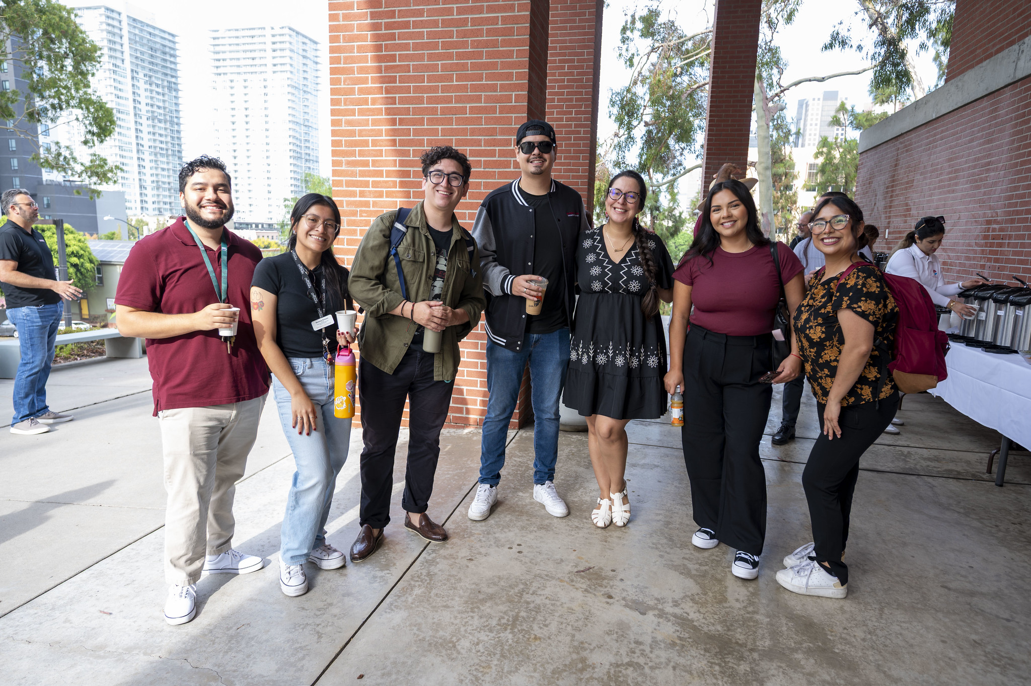 
Seven employees pose for a group photo.

