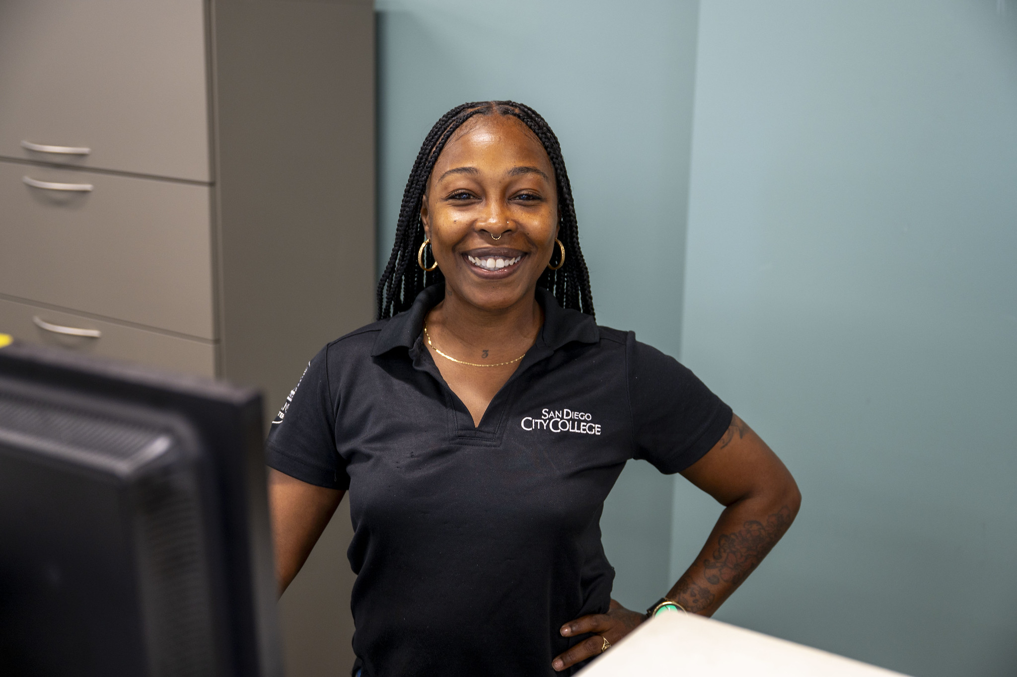
A City College employee at her desk.
