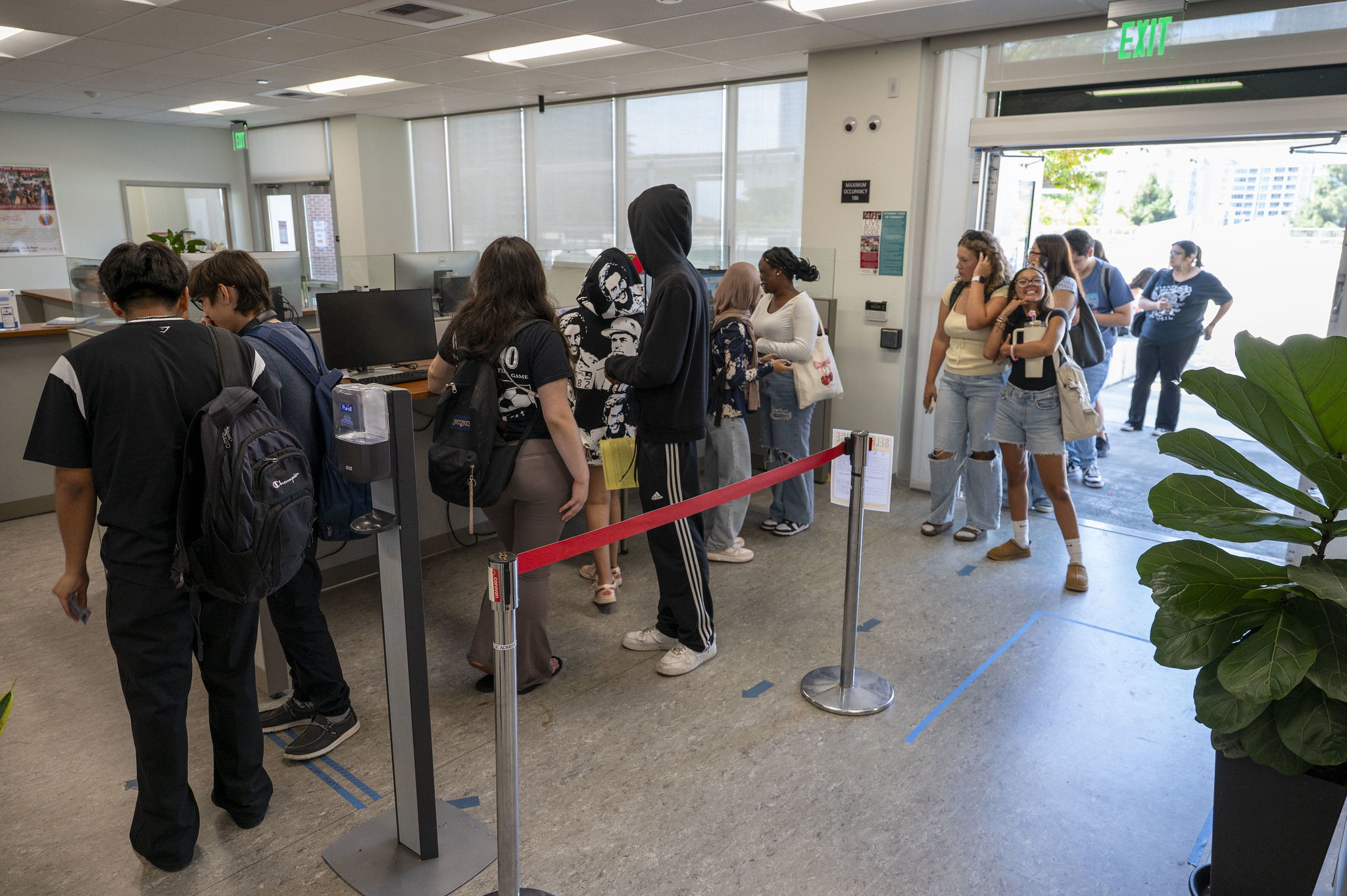 
Students at a counter waiting in line.
