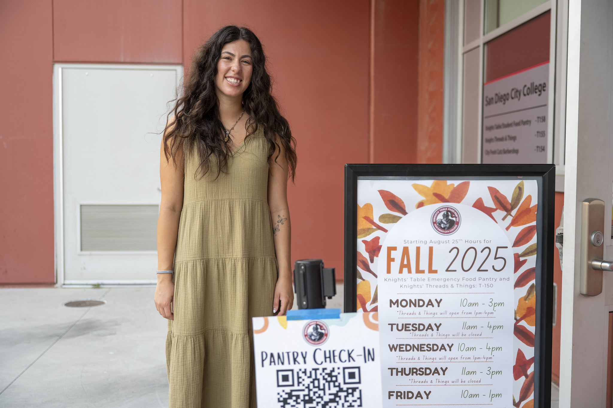 
A woman at the entrance of the Knights Table food pantry.

