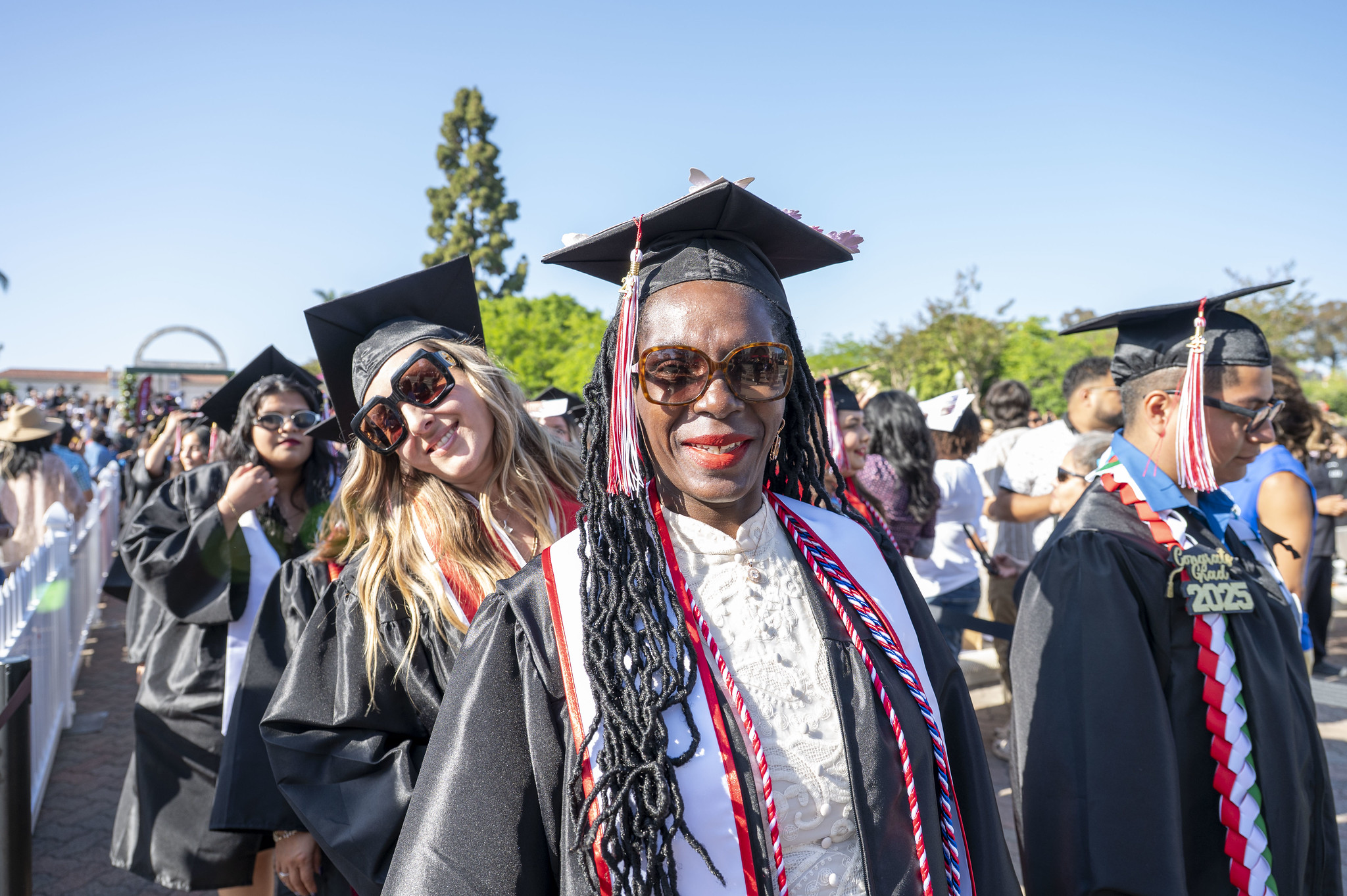 
A group of graduates entering at commencement.
