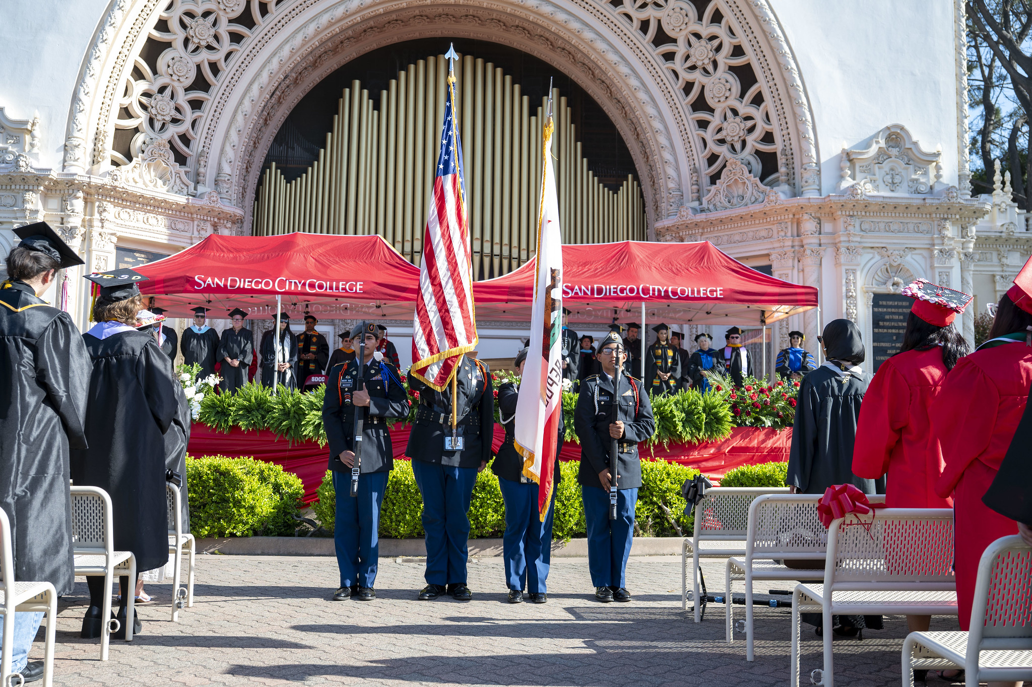 
Sheriff's Department official in dress uniforms hold flags and rifles to kick off the commencement ceremony.
