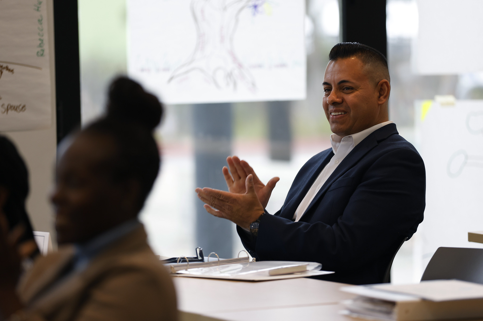 
Alex Napoles applauding at the event.

