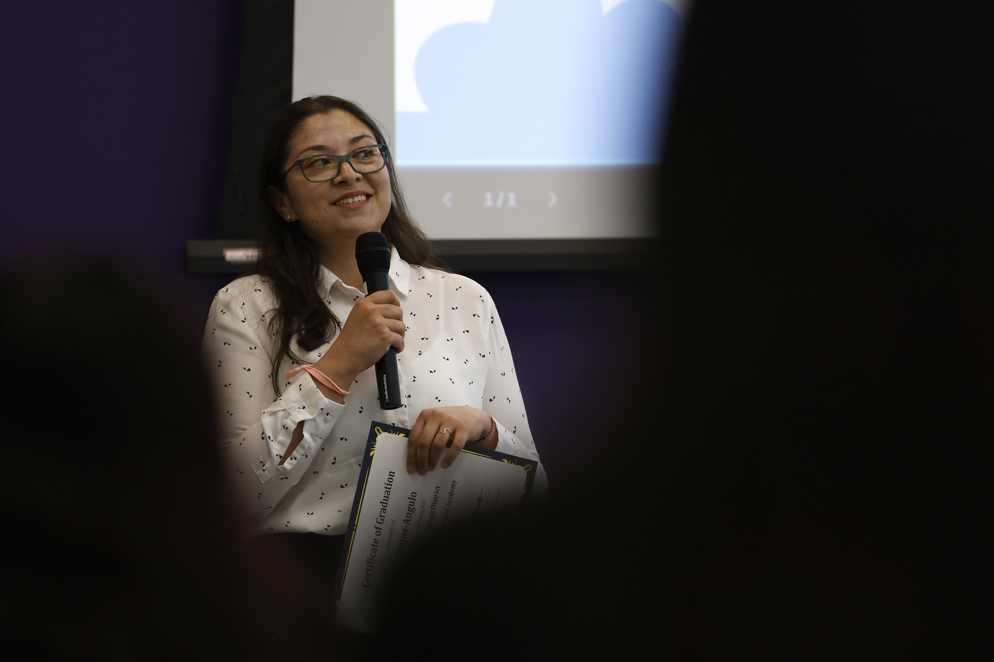 
Kelly Trejos-Angulo speaks after receiving her certificate.
