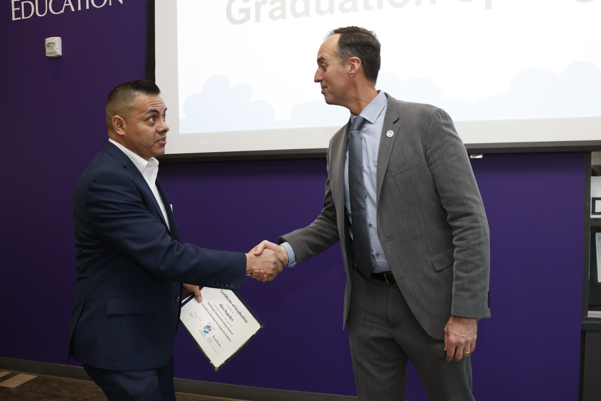 
Alex Napoles shakes the chancellor's hand.
