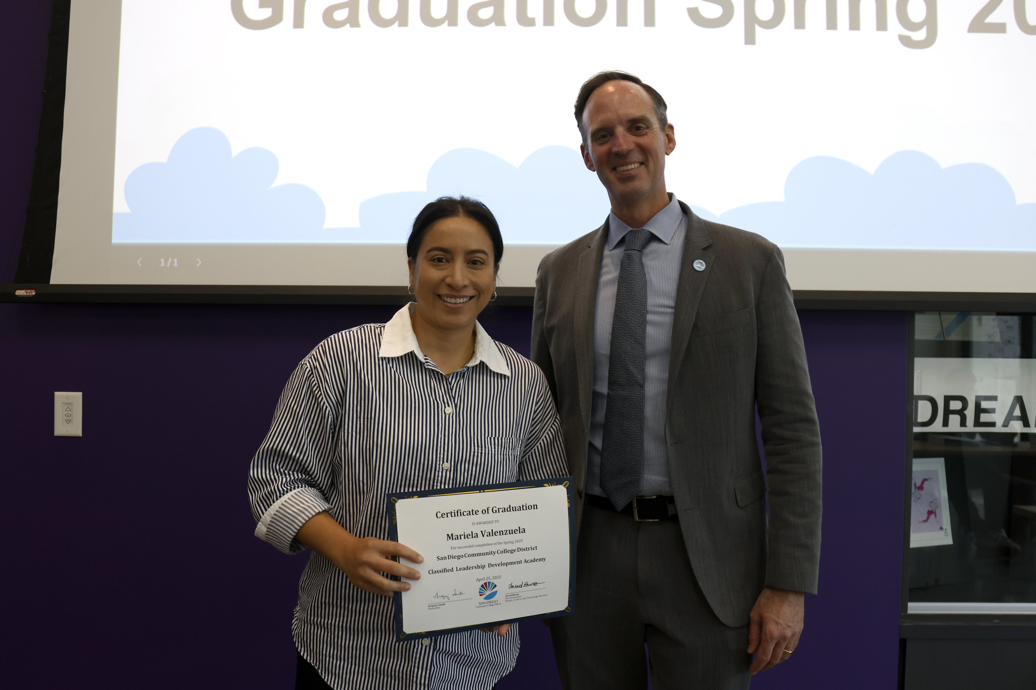 
Mariela Valenzuela holds her certificate with the chancellor.
