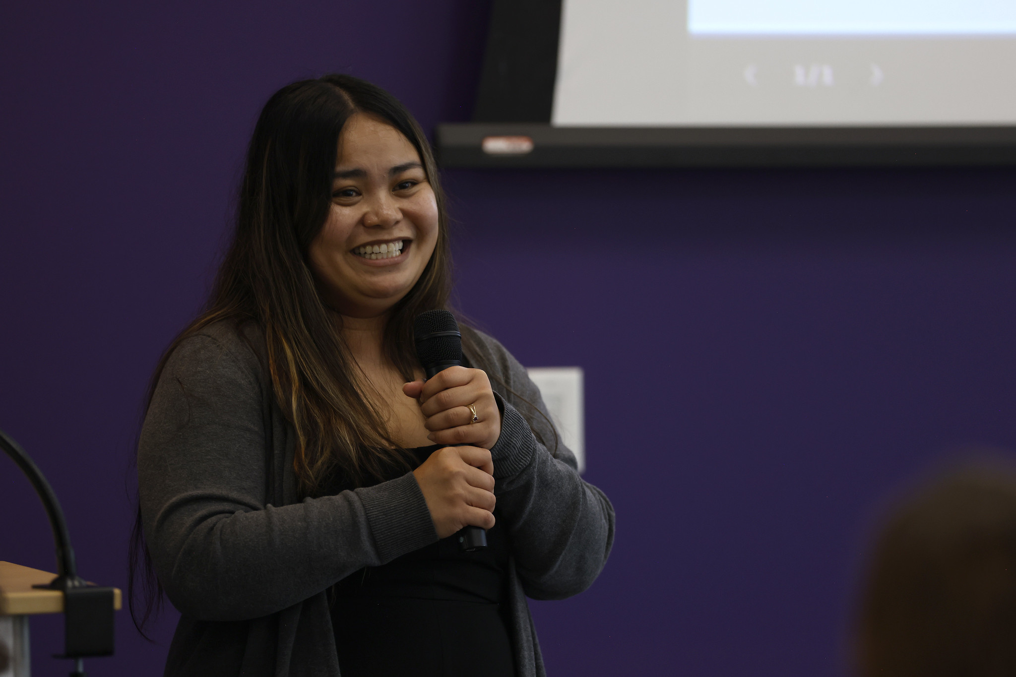 
A woman speaks to the audience.
