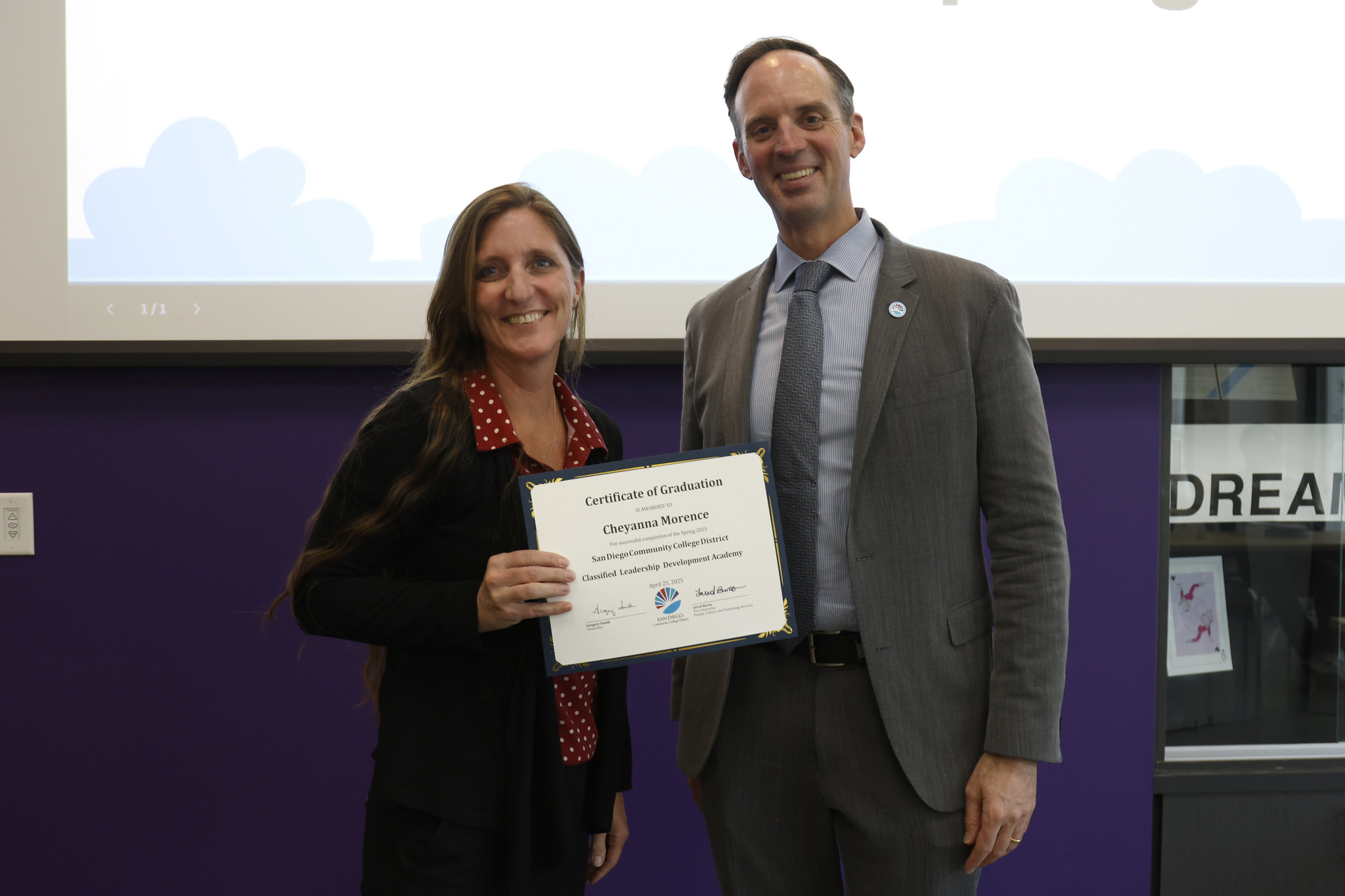 
Cheyanna Morence holds her certificate with the chancellor.

