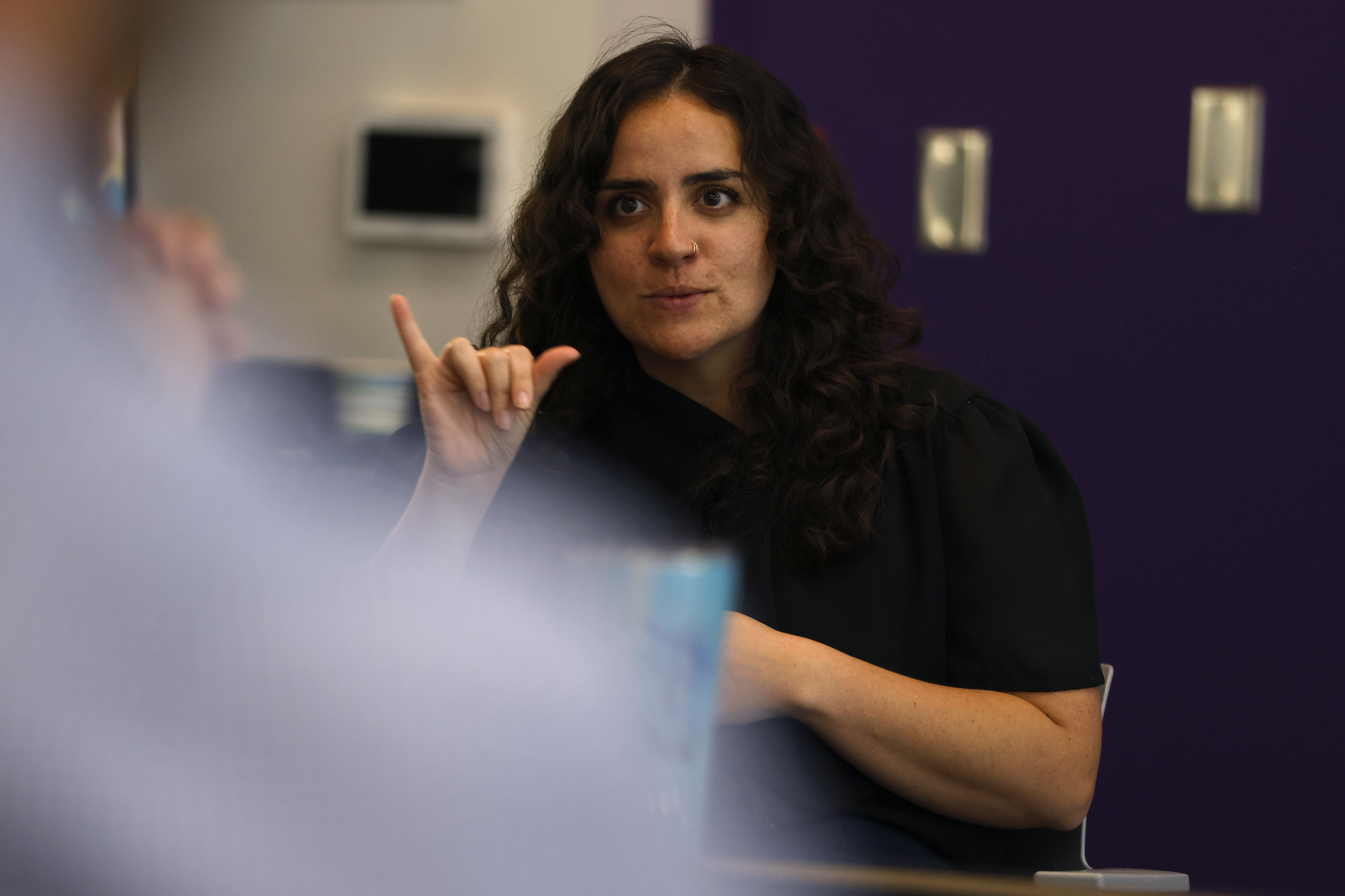 
A sign language interpreter signing at the event.
