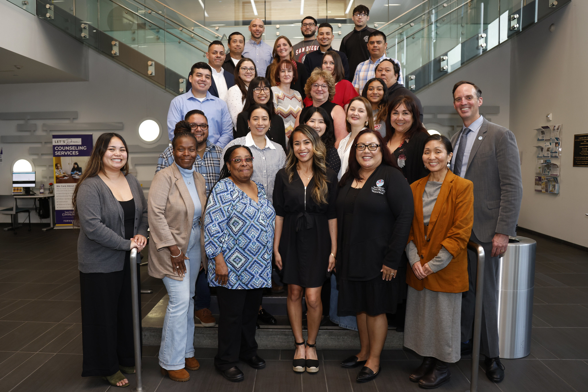 
Chancellor Gregory Smith and 27 employees in the Classified Leadership Development Academy gathered on a staircase.
