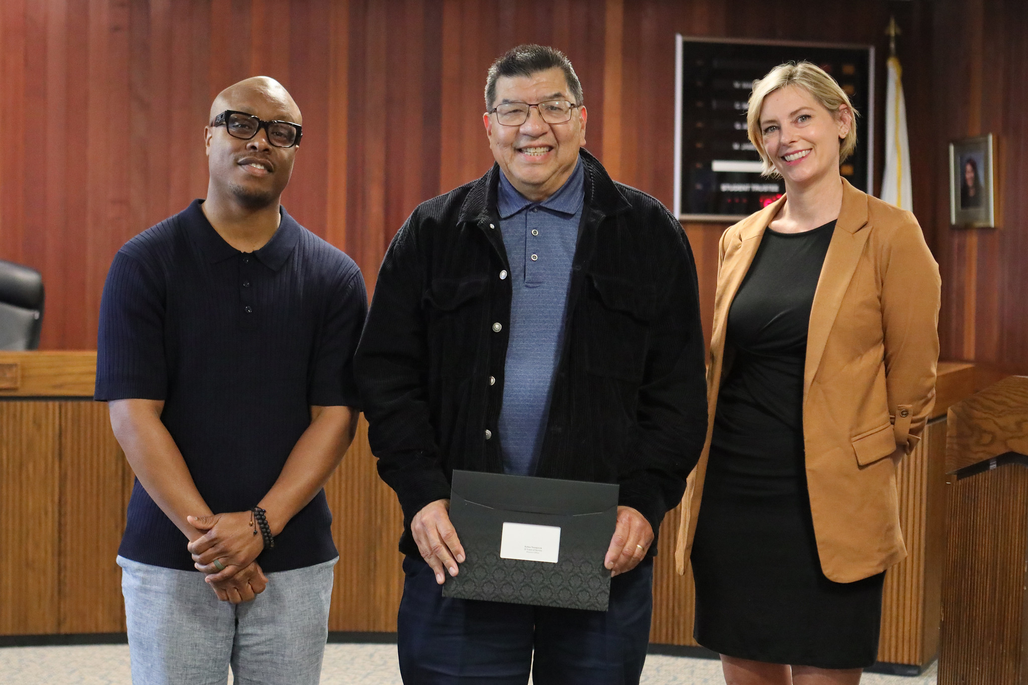 
Three people at the service awards event
