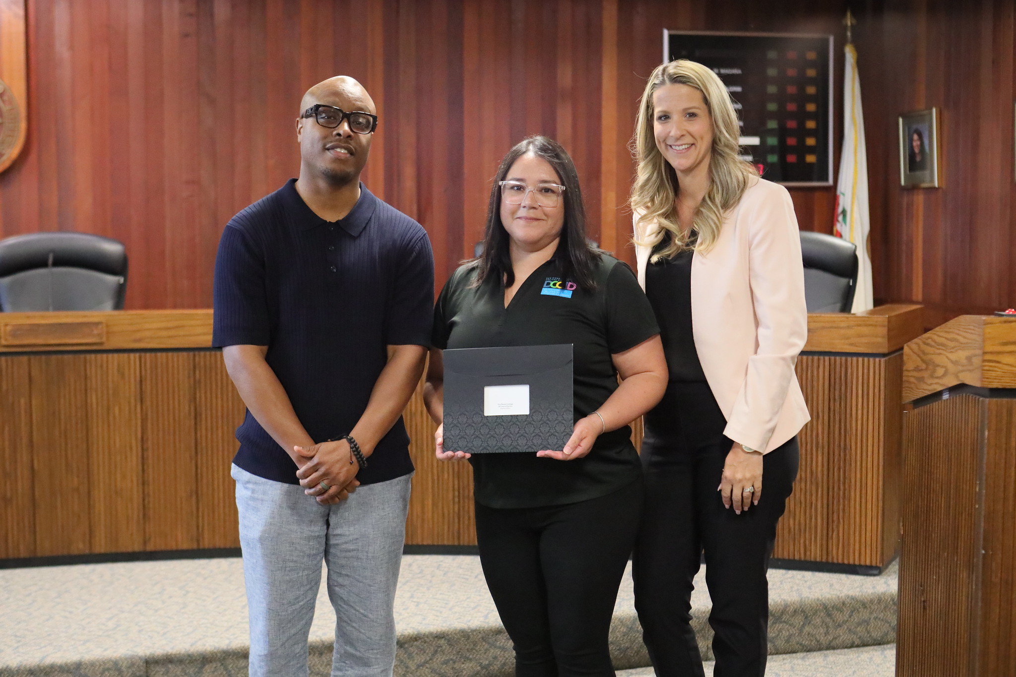 
Three people at the service awards event
